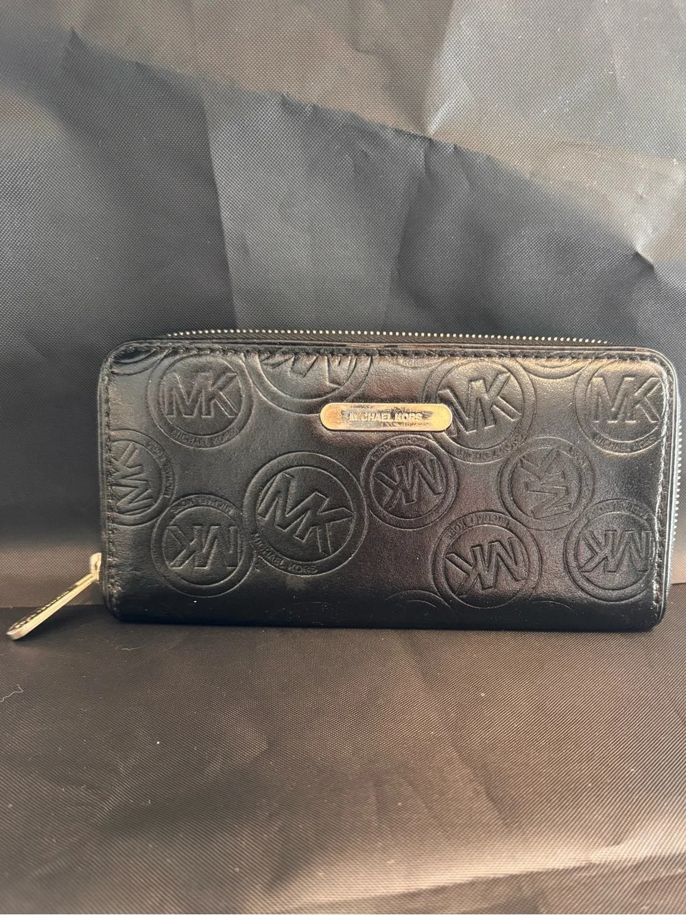 Michael Kors Black Embossed Logo Zip Wallet with Gold Accent